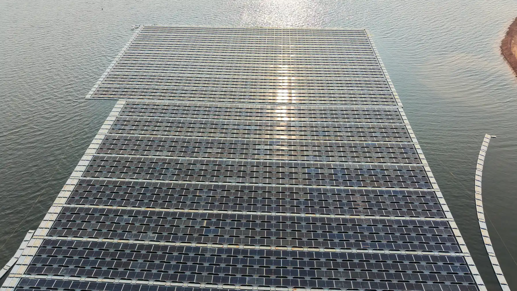 Aerial view of a hybrid hydropower-solar reservoir installation illustrating Batang Ai floating solar in Malaysia