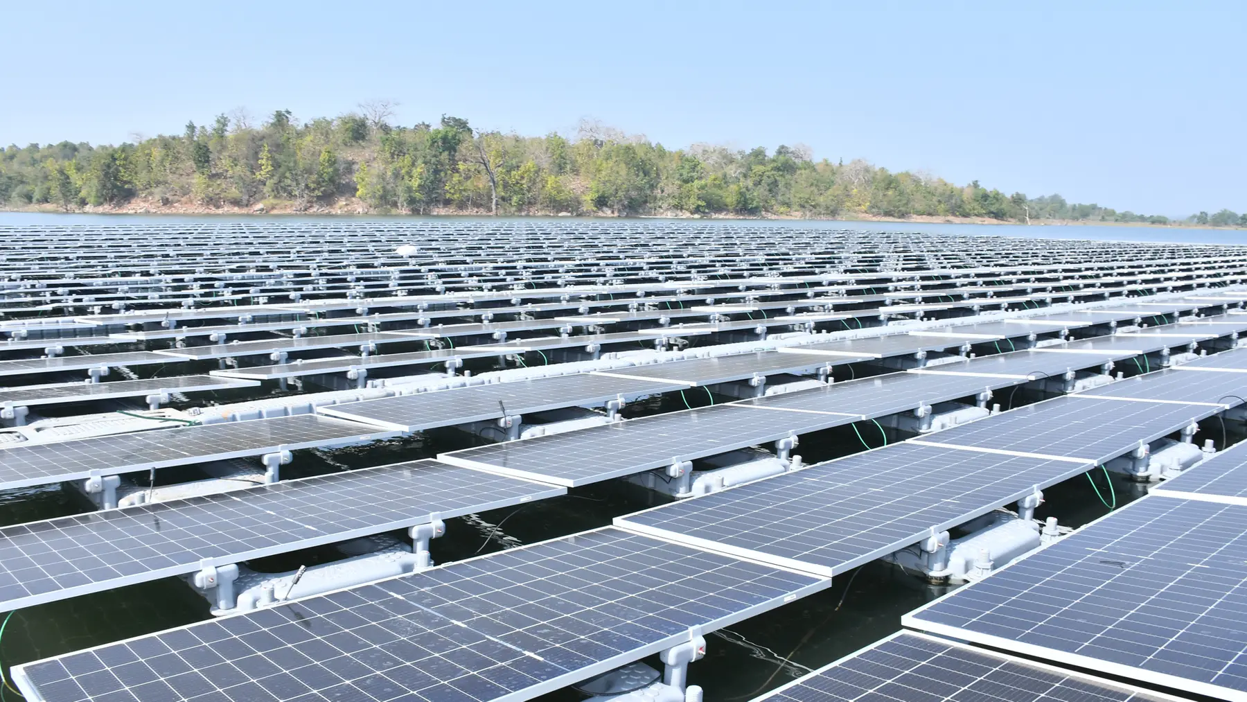 A large industrial floating solar power plant on a raw water reservoir