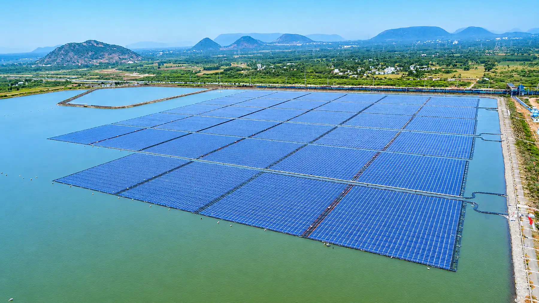 Floating solar array held in place by an anchoring and mooring system